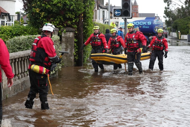 Emergency services attend flooding in Bryansford Avenue Newcastle.

Heavy downpours and flooding this morning have caused disruption across Northern Ireland.