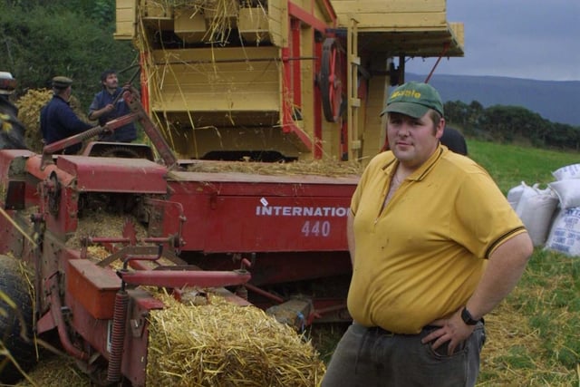 Alistair McLaughlin at the threshing day at Cushendall in October 2002. Picture: Kevin McAuley/Farming Life archives