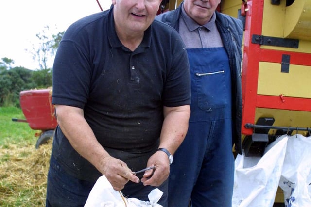 Con Emmerson and Mick Quinn at the threshing day at Cushendall in October 2002. Picture: Kevin McAuley/Farming Life archives