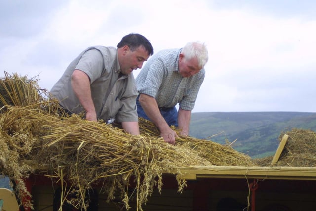 James McAuley and Gabriel Emmerson at the threshing day at Cushendall in October 2002. Picture: Kevin McAuley/Farming Life archives