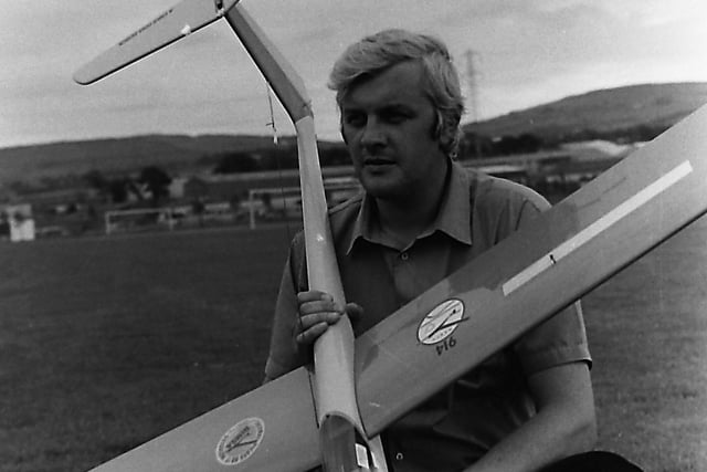 Jack has his heads in the clouds: Jack Chapman from Magherafelt, Co Londonderry, with his Hi-Phase 128 inch high performance sail plan at the Northern Ireland Model Soaring Association's open competition at Mallusk, Co Antrim, in September 1980. Picture: News Letter archives