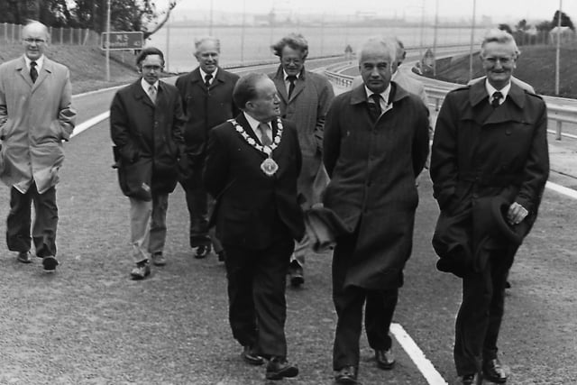 New £4m road link helps beat the traffic jams: Queue weary Belfast commuters in September 1980 had a welcome release when the province's M5 motorway link was opened. Environment Minister Philip Goodhart warned at the official ceremony that another motorway in Northern Ireland was highly unlikely for some years. He said: “Opening a new motorway doesn't happen anywhere in the world very often and it hasn't happened in Northern Ireland for 10 years – and its not likely to happen again in the near future unless we re-classify the M1-M2 link.” The Environment Minister is pictured walking along the new M5 at Greencastle in September 1920 along with the Mayor of Newtownabbey, Alderman Jim Smith and Mr Noal Prescott, director Road Services, DOE. Picture: News letter archives