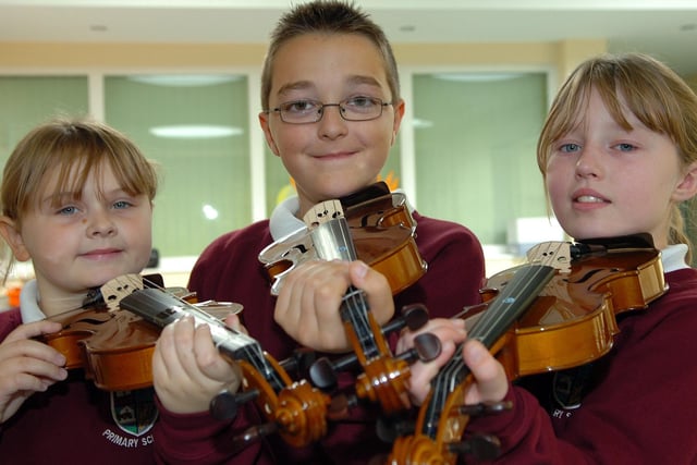 Pupils from Cookstown Primary School Emma Nelson, Jonathan Whensley and Emma Freeburn who have recently passed their violin initial exam. Missing from the picture is Danielle Hamilton.mm43-304sr