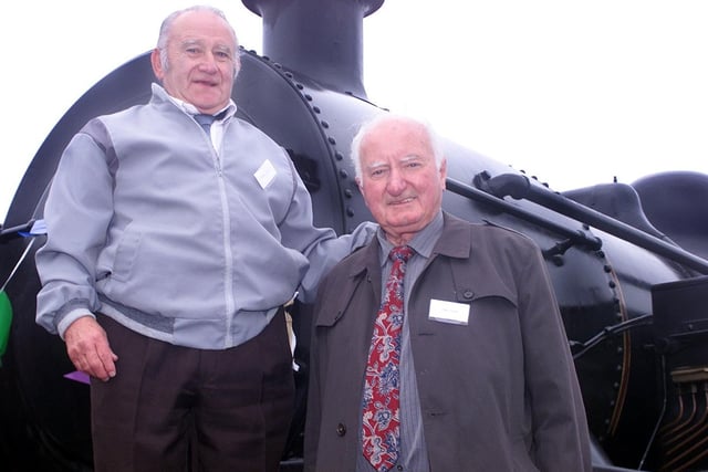 Bobbie Quail and Jimmy Donnelly, who both worked on the railway for 49 years, on board the steam train at Whitehead station, Co Antrim, in August 2002. Picture: Andy McConnell/News Letter archives