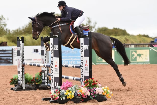 Rachel Hall riding LKC Miss Cloverfield, jumping clear in the 1m. Pictures John O'Connor