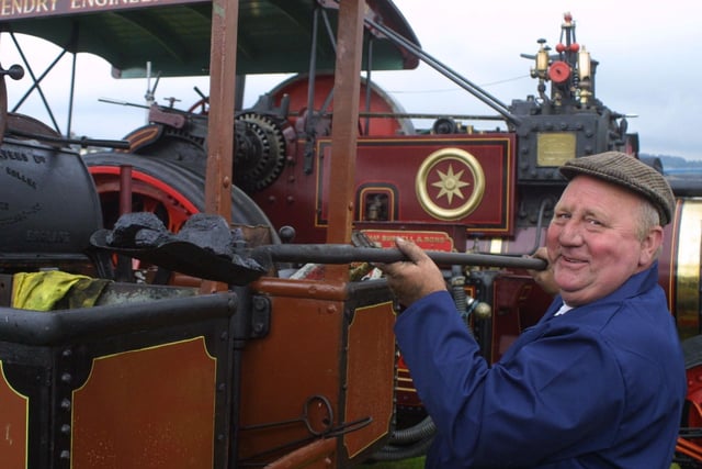 Eric Wilson from Antrim stokes up his engine at a 2002 steam rally in Ballymena. Picture: Kevin McAuley/News Letter archives