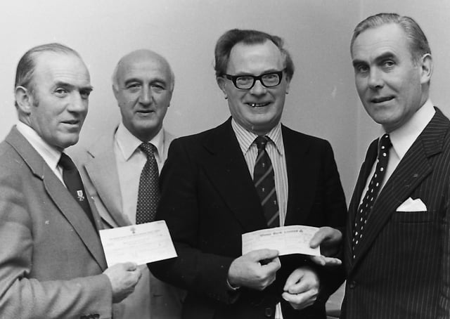 Mr Roy McDougall, right, commercial manager BP, handing over cheques to Mr Arthur McAlister, YFC secretary, and Mrs Lawrence McMillan, chairman of the NI Ploughing Association, in September 1980. Included is Mr Frank Espley, secretary of the NIPA. Picture: News Letter archives