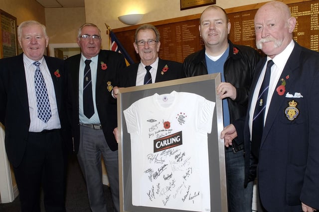 Stephen Thornbury, second right, of Annaghview Court, was the winner of a signed and framed Glasgow Rangers shirt in a raffle organised by Portadown Royal British Legion which raised £630 for the Poppy Appeal in 2010. Pictured with Stephen at the presentation of the shirt are from left, Richard Porter, chairman of the County Armagh Rangers Supporters Club, Billy Stewart, Legion chairman, Stuart Buckley, Legion vice chairman and Tony Hall, Poppy Organiser