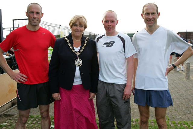 Cllr Meta Crozier, Mayor of Craigavon with the top three finishers in the Craigavon Lakes 10km Mens Race in 2010 (from left) Paul Carroll (2nd); Conor Murphy (1st) and Paul Rowan (3rd)