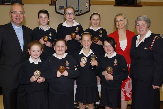 Junior Section prize winners pictured at the annual Inspection & Display held on Thursday night by 320th Kilfennan Girls' Brigade. Included are Rev. Rob Craig, Company Chaplain, Cheryl Osbourne, Inspecting Officer, and Roberta Smith, Company Captain. LS18-149KM10