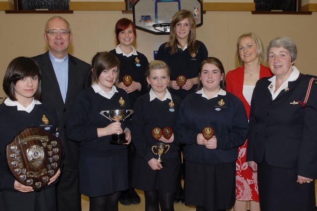 Company Section prize winners pictured at the annual Inspection & Display held on Thursday night by 320th Kilfennan Girls' Brigade. Included are Rev. Rob Craig, Company Chaplain, Cheryl Osbourne, Inspecting Officer, and Roberta Smith, Company Captain. LS18-150KM10