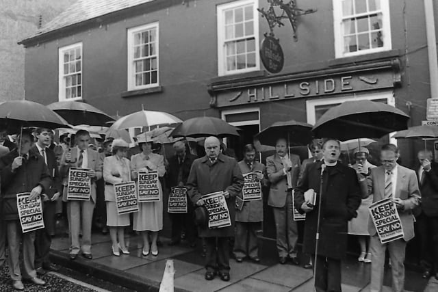 The Reverend Stanley Barnes leads member of the Hillsborough Free Presbyterian Church in prayer as they held at protest out the village’s Hillside Inn in October 1987. October 1987 marked the end of a 64 year ban on Sunday drinking and it was marked by packed pubs across Northern Ireland, reported the News Letter, but protestors were out in force with Free Presbyterian pickets present outside many public house doors. DUP leader Ian Paisley joined other members of his church outside a Belfast city centre pub where they conducted a short religious service. Nelson McCausland, a spokesperson for the Lord’s Day Observance Society, said: “We will never admit surrender in this campaign. We recognise that the publicans have won this battle but they have not won the war. We are quite prepared to continue our fight for many years if necessary to see the law reversed”
