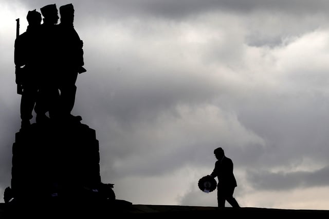 A veteran lays a wreath at the Commando Memorial at Spean Bridge, near Fort William on Remembrance Sunday. PA Photo. Picture date: Sunday November 8, 2020. See PA story SCOTLAND Remembrance. Photo credit should read: Andrew Milligan/PA Wire
