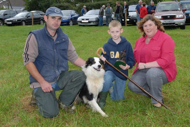 Pearce McFadden's dog, Joe was the winner of the Best County Antrim Dog section at the Cairncastle Sheepdog Trials in September 2007. With him is Kieran McFadden and the event judge, Doria Hill, manager of the Northern Bank in Larne. Picture: Larne Times archives