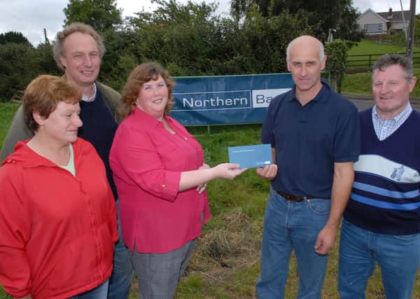 Doria Hill, manager of the Northern Bank in Larne, hands over a sponsorship cheque to the treasurer of the Cairncastle Sheepdog Society,  Robert Stewart. Also pictured are Susan Kelly, the assistant Secretary of the Northern Ireland Sheepdog Society and Campbell Tweed and Willie McWhirter from the Cairncastle Sheepdog Society. Picture: Larne Times archives