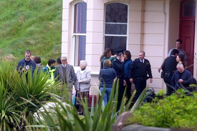 Police comfort the relatives at the scene in June 2002. Picture: Kevin McAuley