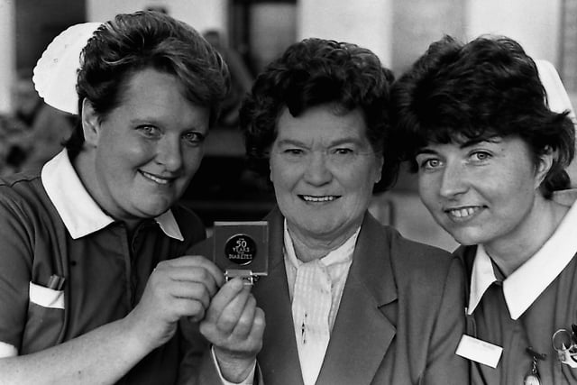 Elizabeth Woodcock, 66, of Kirkliston Park, east Belfast, show her medal for 50 years of successful insulin treatment to Ulster Hospital Sister Moyra Campbell, left, and staff nurse Pauline Upton. The Belfast pensioner had been attending Dr Ken Nelson's diabetic clinic at the Ulster Hospital since 1973 having become diabetic in July 1939 aged 16. Dr Nelson said: “Elizabeth is the sixth person to attend our clinic to achieve this distinction of 50 years of successful treatment with insulin. Today Mrs Woodcock remains in good health and good diabetic control and does not have evidence of diabetic complications. The award of the Nabarro Medal to Mrs Woodcock with serve as encouragement to other diabetic patients.” Picture: News Letter archives