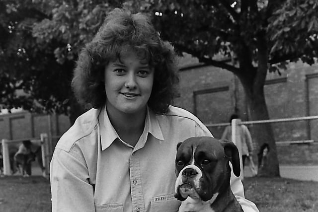 Jane Monaghan from Drogheda displayed justifiable pride in her Boxer, Dionne, at the Belfast dog championships at Balmoral in October 1989. Picture: News Letter archives