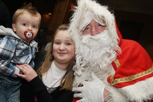 Brogan and Jaden Logue say hello to Santa, when he visited Greysteel to switch on the Christmas lights