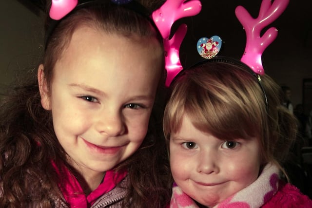 Leah Ferris (7) and Sophia McGrugan (4) were the special singers in Ballyduff as Santa arrived to turn on the Christmas Tree lights and to mark the start of Christmas