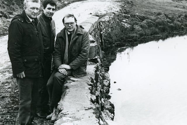 BOOST FOR RATHLIN ISLAND: Pictured in February 1987 are Mr John Gault, Mr Patrick Rodgers and Mr Michael McCourt. A new water supply system for Rathlin Island had been handed over to the Department of the Environment by the engineering firm responsible for its design and installation. John Gault, senior partner of Newtownabbey based John Gault Partnership had begun work on the project five year previously when islanders depended on open springs and private uncovered pipelines to bring untreated water from natural lakes lying on top of the rocky topography, down to the main Church Bay settlement. The new system gave the majority of the residents pure tap water. The £360,000 project took lake water to the newly constructed treatment plant. There, the water was purified and pumped to a small service reservoir, which served the Church Bay area, the most densely populated part of Rathlin Island. Michael McCourt, the project engineer, said: “The system is quite unique and set us a considerable number of problems i