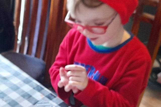 Elijah Desjardins writing his letter to Santa.