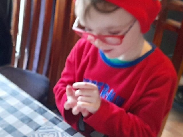 Elijah Desjardins writing his letter to Santa.