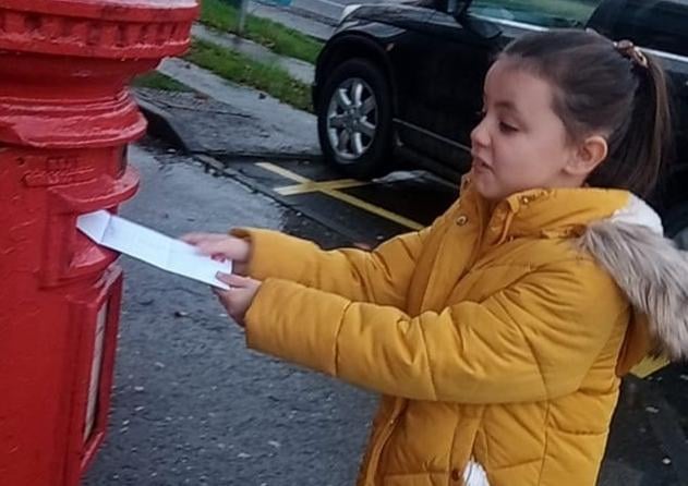 Alicia Nash posting her letter to Santa