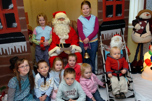 Some of the young people caught on camera with Santa in his grotto at the 'Breakfast With Santa' event held at Coagh Primary School last Saturday morning organised by the school's Parents Support Group.mm51-369sr