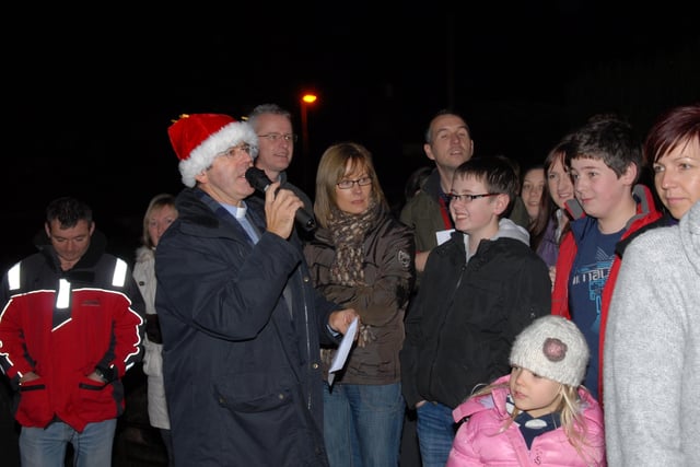 Archdeacon Stephen Forde leads the countdown for the Gleno Christmas tree switch on