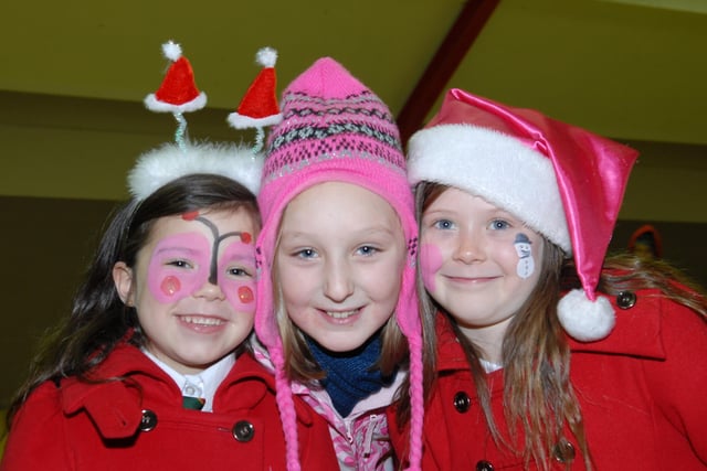Gracie, Jordanne and Charlie all wrapped up after the Dixon Park Christmas tree switch on
