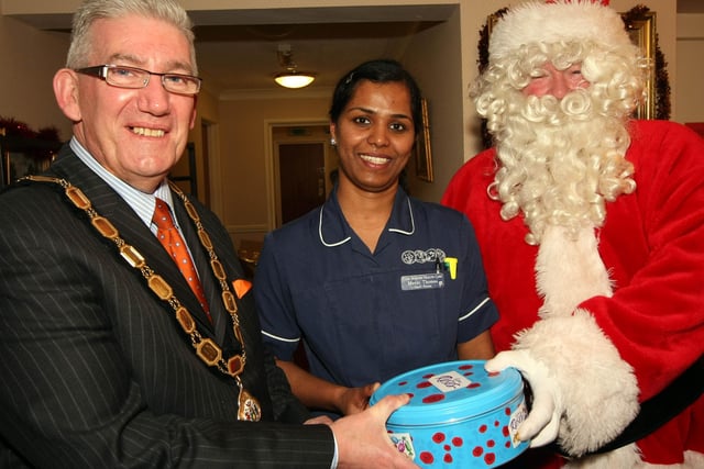 Deputy Mayor Tommy Kirkham along with Santa presented a Christmas gift to Manju Thomas of Whiteabbey Care Home during his seasonal visits
