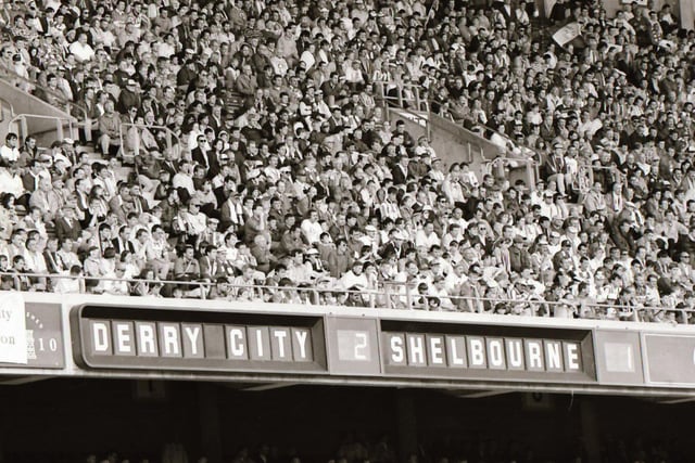A section of the 8,000 strong support pictured at the FAI Cup Final at Lansdowne Road in 1995 as the scoreboard makes good reading for Derry fans.