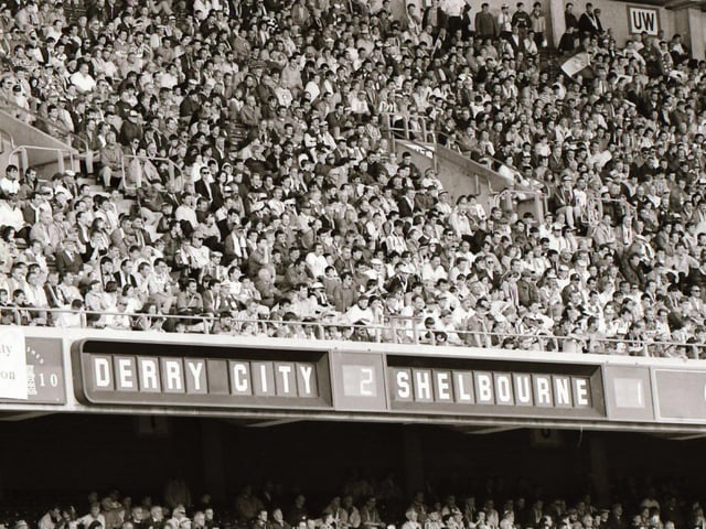 A section of the 8,000 strong support pictured at the FAI Cup Final at Lansdowne Road in 1995 as the scoreboard makes good reading for Derry fans.