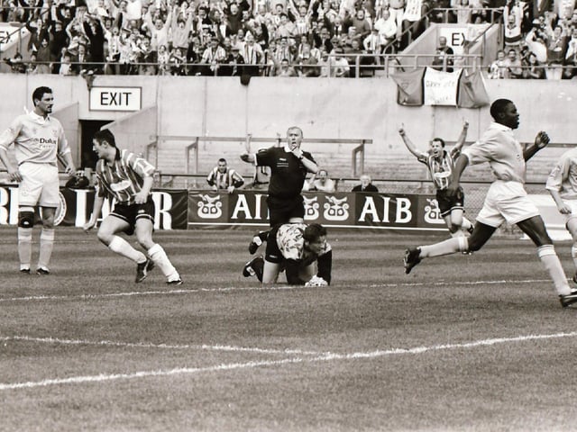 GOAL! Peter Hutton wheels away to celebrate after being allowed space to pick out his spot and give Derry the lead in Dublin.