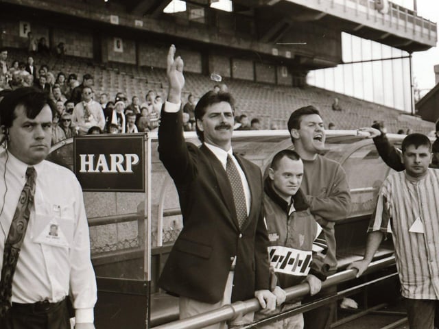 Derry City boss, Felix Healy and first team coach, Jack Kaey get a helping hand from No.1 supporter, John Pio O'Doherty at Lansdowne Road.
