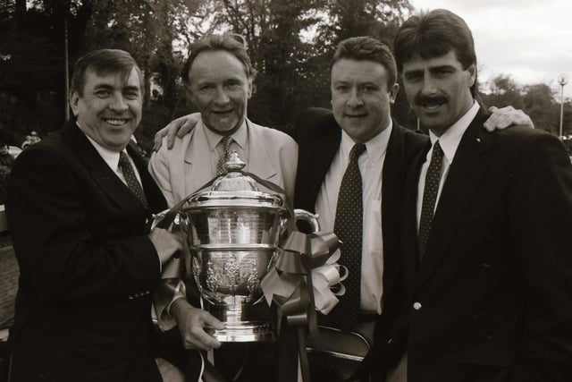 A delighted Philip Johnston, Phil Coulter, Philip O'Doherty and Felix Healy pose with the FAI Cup after Derry City's second ever success in the competition.