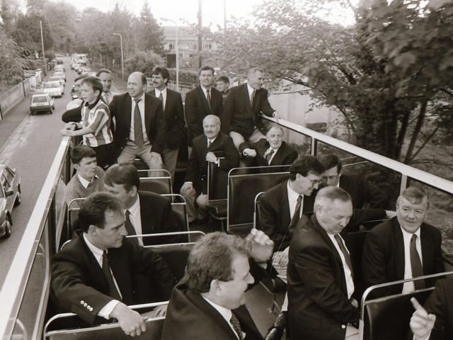 Derry City directors and management enjoy the open top bus ride through the streets of Derry after the FAI Cup triumph in Dublin.
