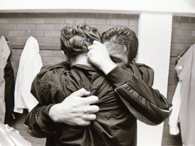 Derry skipper, Dermot O'Neill embraces his brother Tony in the dressing room after winning his first ever FAI Cup winners' medal at 33 years of age.
