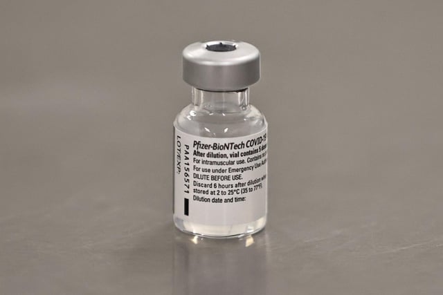 A phial of the Pfizer/BioNTech Covid-19 vaccine ahead of being administered at the Royal Victoria Hospital, in Belfast, on the first day of the largest immunisation programme in the UK's history