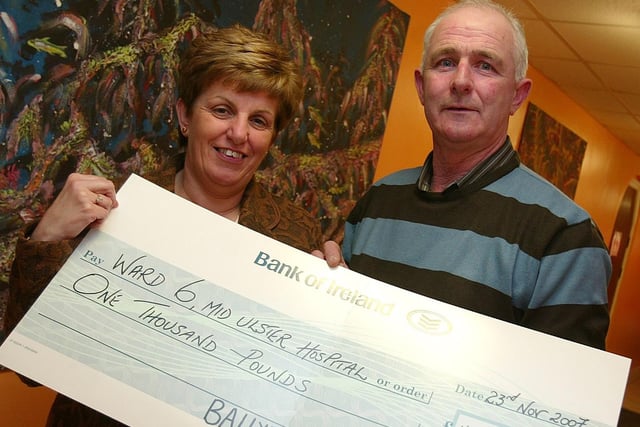 Frank Bigmore Chairman of Ballyronan And District Vintage Club presents a cheque for £1000 to Mary O Neill on behalf of Ward 6 Mid Ulster Hospital Magherafelt. Proceeds of collections and fund raising events which were organized by the Club throughout the year.mm49-406sr