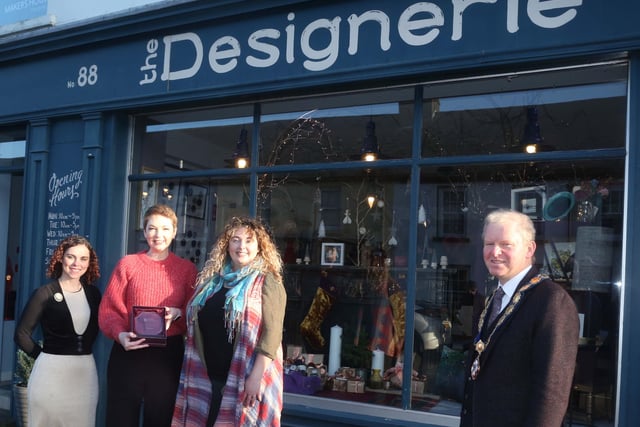 The Designerie was the winner of the Best Christmas Window in Bushmills. Deputy Mayor of Causeway Coast and Glens Borough Council Alderman Tom McKeown presented the prize to Leeann Irwin, Claire McDowell and Sarah Mackay