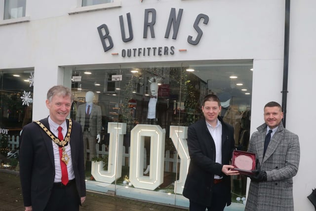 Burns Outfitters was the winner of the Best Christmas Window in Coleraine and the Mayor of Causeway Coast and Glens Borough Council Alderman Mark Fielding presented the award to Jamie Burns and Michael Moffatt