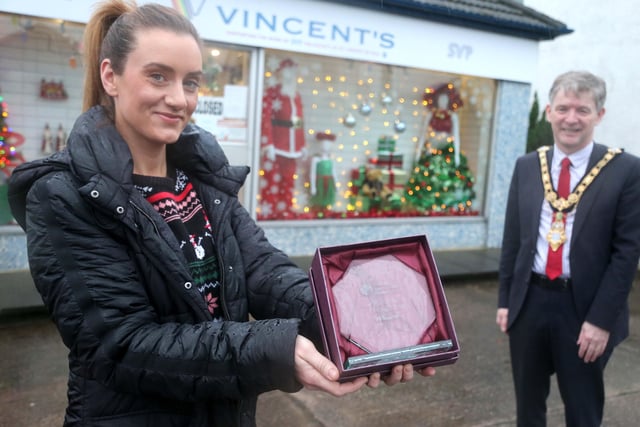 In Cushendall Vincent's was the winner of the Best Christmas Window and the Mayor of Causeway Coast and Glens Borough Council Alderman Mark Fielding presented the award to Seana Lynn