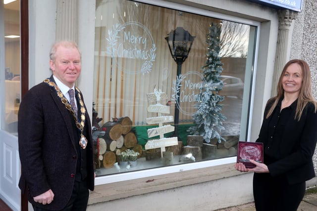 Kerr Insurance Group was the winner of the Best Christmas Window in Kilrea. Deputy Mayor of Causeway Coast and Glens Borough Council Alderman Tom McKeown presented the prize to Office Manager Bernie Downey