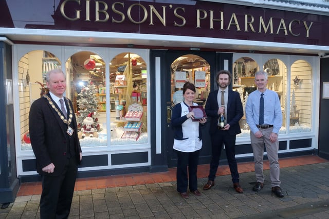 Gibson's Pharmacy was the winner of the Best Christmas Window in Limavady. Deputy Mayor of Causeway Coast and Glens Borough Council presented the prize to Jenny Miller, Sean Devlin and David Gibson