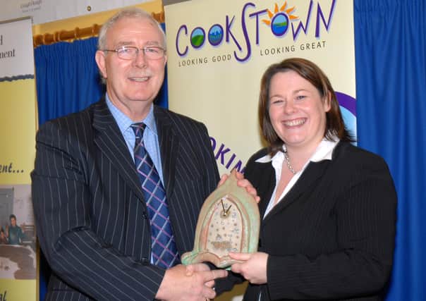 Cookstown Council chief Executive Michael McGuckin makes a presentation to Michelle Gildernew, Minister for Agriculture and Rural Development, at the official opening of Ballyronan Marina and Caravan Park, after extensive improvements. mm4107-111ar.