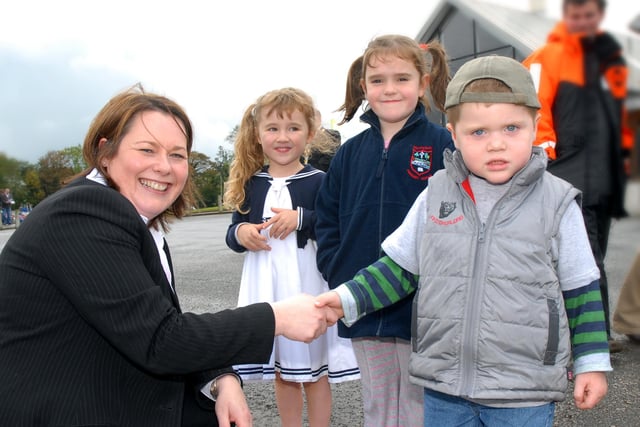 Minister for Agriculture and Rural Development Michelle Gildernew meets some of the young people who attended the official opening of Ballyronan Marina and Caravan Park, after extensive improvements.mm4107-107ar.