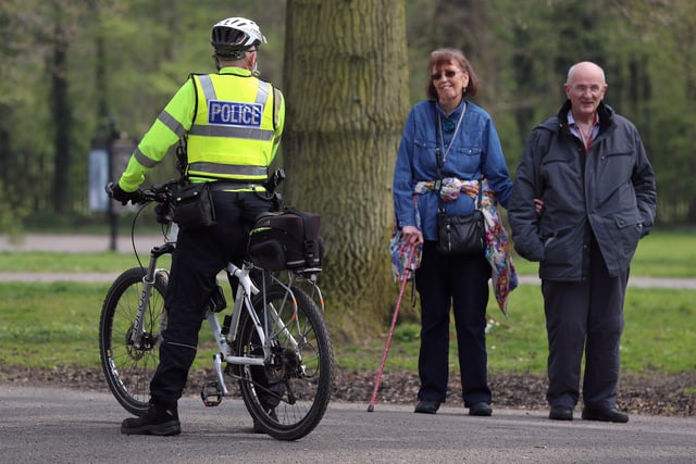 PACEMAKER, BELFAST, 10/4/2020: PSNI officers on bicycles talk to members of the public as they patrol Ormeau Park in Belfast on Good Friday. Police patrols will be stepped up over the Easter to maintain social distance and prevent large gatherings during the holiday weekend. 
PICTURE BY STEPHEN DAVISON