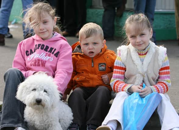 Martine McCann, Edele McCann and Kevin McCann brought their pet dog along to the Toome Fair. AT16-307JC